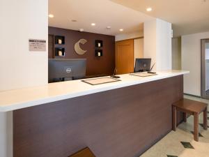 an office with a reception counter with a desk at Comfort Inn Yokaichi in Higashiomi