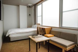 WPÜ HOTEL HAKONE客房内的一张或多张床位