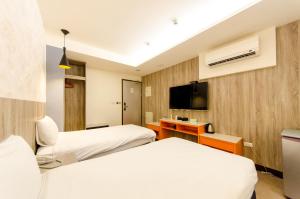 Кровать или кровати в номере P&E Hotel