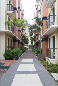 a walkway between two buildings in a city at 2 Bedroom Condo Unit Fully Furnished in Manila