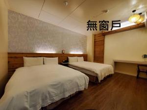 Tempat tidur dalam kamar di Cocos Hot Spring Hotel