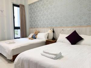 Postel nebo postele na pokoji v ubytování Forrest Cafe Villa