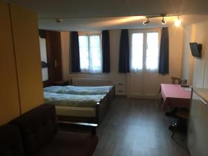 Uma cama ou camas num quarto em Hotel Löwen