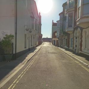 an empty street with buildings on either side at The Wilton Weymouth in Weymouth
