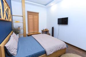 Cama o camas de una habitación en HomeStay Võ Thị Yến