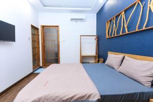 Ένα ή περισσότερα κρεβάτια σε δωμάτιο στο HomeStay Võ Thị Yến