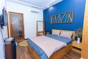 Cama o camas de una habitación en HomeStay Võ Thị Yến