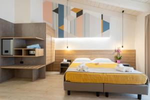Postel nebo postele na pokoji v ubytování Horizon Hotel Badesi