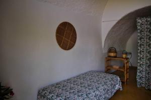 a bedroom with a bed and a small table at Casa Colonica in Gallipoli