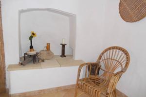 a room with two chairs and a mirror at Casa Colonica in Gallipoli