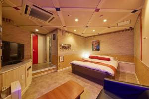 מיטה או מיטות בחדר ב-Hotel Coco Club Azumino (Love Hotel)