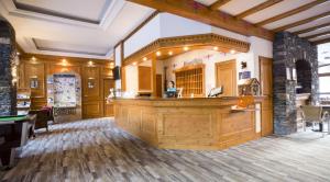 a bar in a pub with a pool table at Hôtel Club mmv Le Val Cenis *** in Lanslebourg-Mont-Cenis