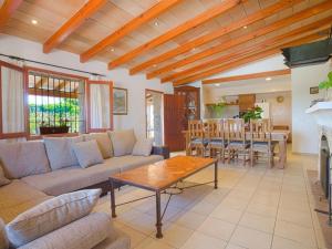 a living room with a couch and a table at Villa Cifre Alcudia in Alcudia