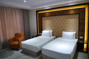 Postel nebo postele na pokoji v ubytování Hotel Hills