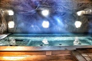 a swimming pool in a cave with water in it at Hotel Miramare & Spa in Sestri Levante