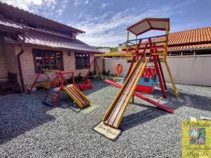 a group of playground equipment in a yard at Pousada Vivenda dos Açores in Penha