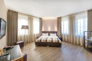 Säng eller sängar i ett rum på Altstadt Hotel & Café Koblenz