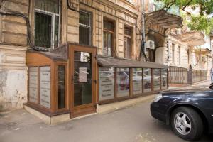 a building with a kiosk on the side of a street at Apartament Park3 in Odesa