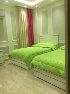 Postel nebo postele na pokoji v ubytování Ramco For Furnished Apartments And Accommodation Compound Leila