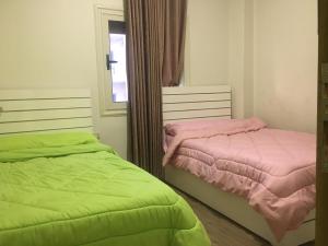 Postel nebo postele na pokoji v ubytování Ramco For Furnished Apartments And Accommodation Compound Leila