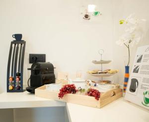 a kitchen counter with a tray of fruit on it at HOME CARPEDIEM in Verona