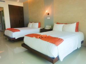 Voodi või voodid majutusasutuse Artisan Playa Esmeralda Family Beach Hotel toas