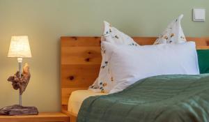 Posteľ alebo postele v izbe v ubytovaní Ferienwohnung Leuner