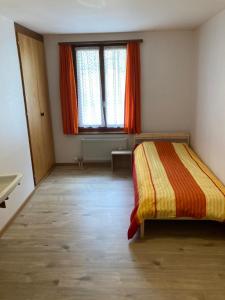 Letto o letti in una camera di Hôtel du Gd-St-Bernard