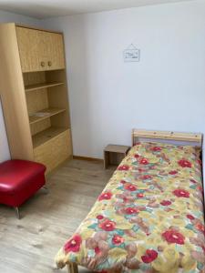 Letto o letti in una camera di Hôtel du Gd-St-Bernard