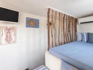 Posteľ alebo postele v izbe v ubytovaní Lets Holidays Charming fisherman house with terrace