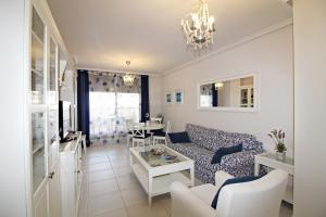 a living room with a couch and a table at Altos de Nuevo Vera in Vera