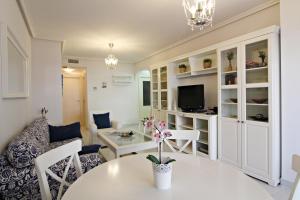 a living room with a table and a couch at Altos de Nuevo Vera in Vera