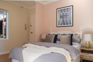 a bedroom with a large bed and a window at Sun-Drenched 1 Bed Studio Apartment In Newtown in Sydney