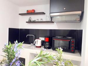 A kitchen or kitchenette at Dioni Holiday House