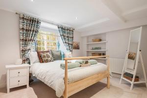 a bedroom with a bed with a teddy bear on it at Stylish Georgian Flat in New Town in Edinburgh