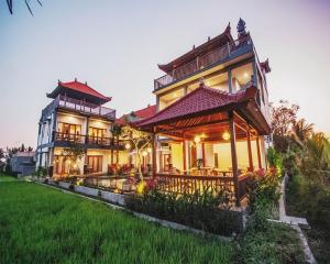 a large house with a building at Villa Silas in Ubud