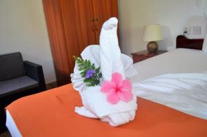 Postel nebo postele na pokoji v ubytování Rising Sun Guesthouse