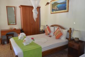 Postel nebo postele na pokoji v ubytování Rising Sun Guesthouse