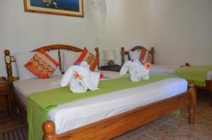 Postel nebo postele na pokoji v ubytování Rising Sun Guesthouse