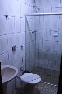 Ванная комната в Domus Hotel Veneza Ipatinga