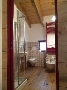 a bathroom with a toilet and a sink at B&B La Locanda in Macugnaga