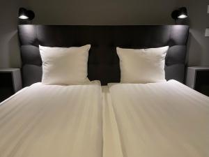 Postel nebo postele na pokoji v ubytování Unique Hotel Jungfrugatan