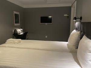 Postel nebo postele na pokoji v ubytování Unique Hotel Jungfrugatan