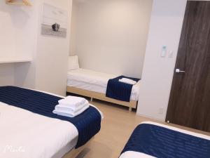 Postel nebo postele na pokoji v ubytování Hotel Emir