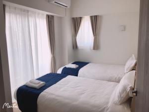 Postel nebo postele na pokoji v ubytování Hotel Emir