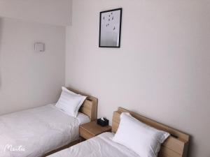 Postel nebo postele na pokoji v ubytování Hotel Emir