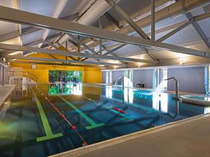 a large indoor swimming pool in a building at Midlands Park Hotel in Portlaoise