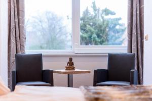 Postel nebo postele na pokoji v ubytování Wellness & Ayurveda Hotel Am Eichenberg