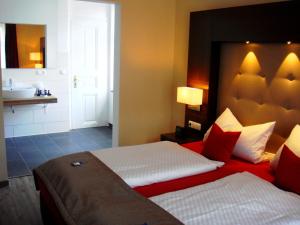 Postel nebo postele na pokoji v ubytování Boutique Hotel Villa Melsheimer