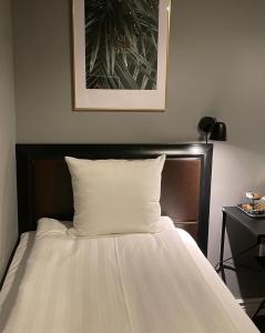 Postel nebo postele na pokoji v ubytování Unique Hotel Jungfrugatan